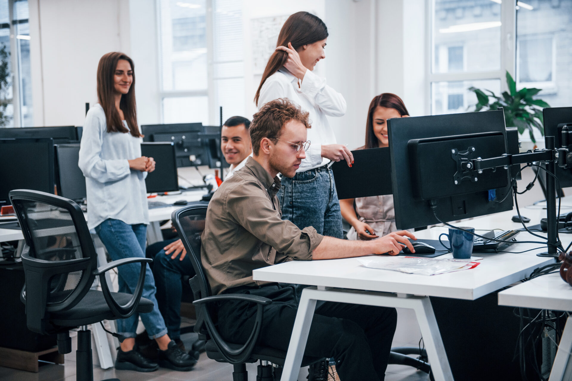Group of young business people that working by computers in the modern office
